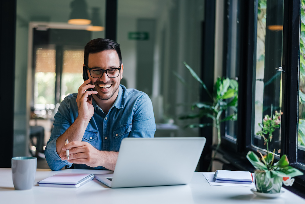 Man sitting at desk with computer
